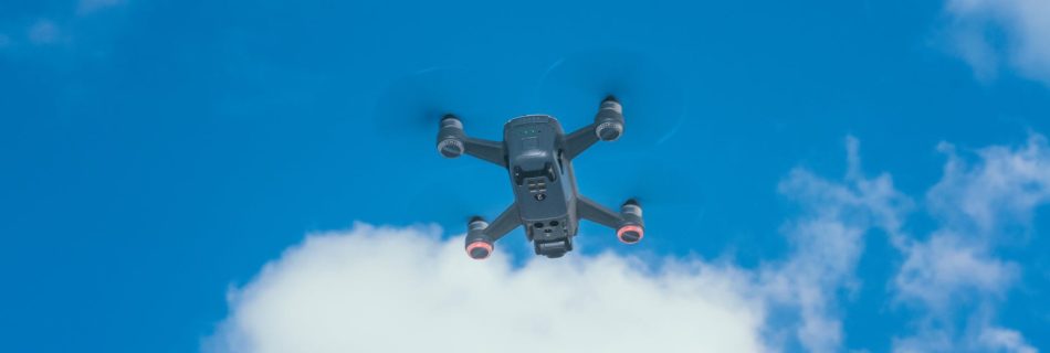 drone flying under blue cloudy sky in daytime